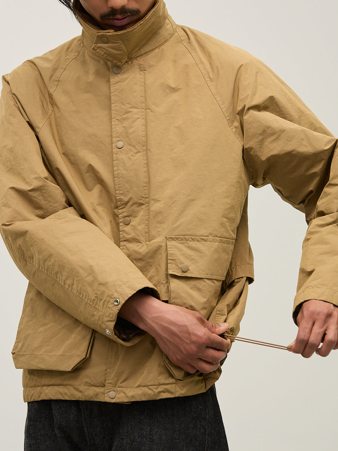 撥⽔コーディングポリエステルハン ティングダウンJKT